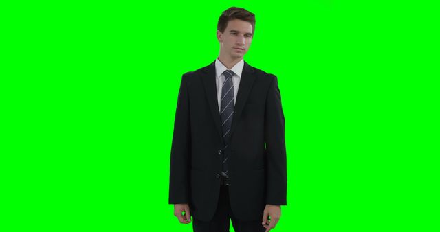Businessman Standing Against Green Screen Background in Suit - Download Free Stock Images Pikwizard.com