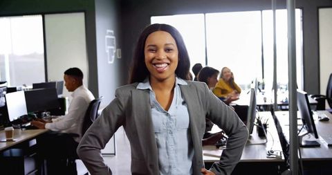 Confident Businesswoman in Modern Open-Plan Office