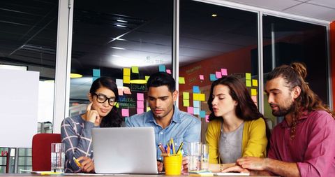 Young Professionals Brainstorming on Laptop in Modern Office - Download Free Stock Images Pikwizard.com