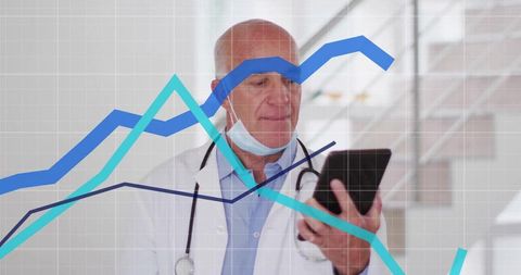 Doctor Analyzing Data on Tablet in Medical Environment
