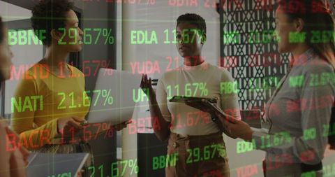 Diverse Businesswomen Collaborating with Financial Graph Overlay