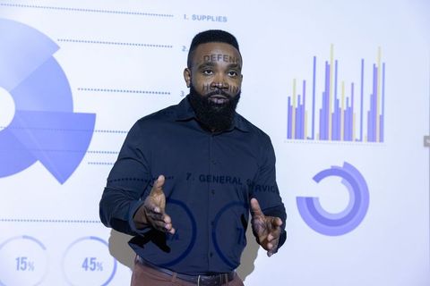 Professional Presenting Business Charts During Corporate Strategy Meeting