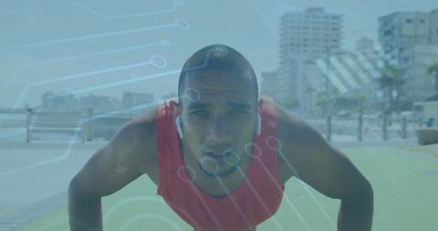 Man Exercising on Seaside Promenade Listening to Music