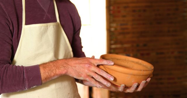 Potter Holding Handmade Clay Bowl in Workshop - Download Free Stock Images Pikwizard.com