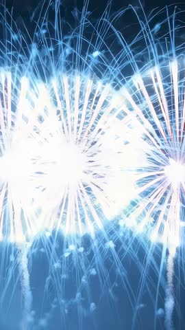 Vertical video launching fireworks arcing with red trails and blooming white columns