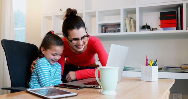 Smiling Mother and Daughter Using Laptop at Home, Cozy Familly Time - Download Free Stock Images Pikwizard.com