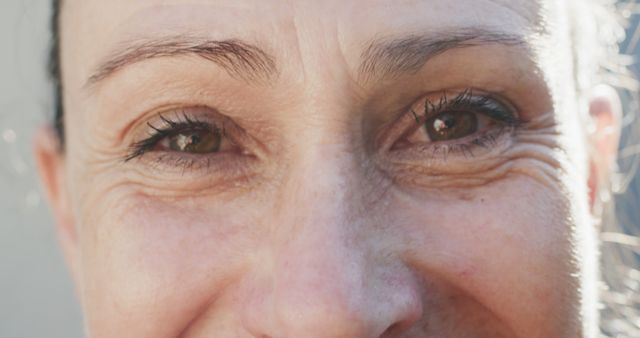 Close-Up of Smiling Woman's Wrinkled Eyes and Face - Download Free Stock Images Pikwizard.com