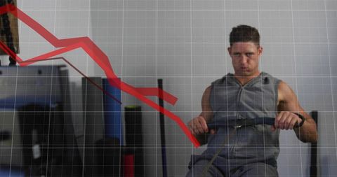 Male athlete rowing on ergometer with declining red graph overlay representing struggle