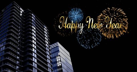 Happy new year celebration with fireworks and cityscape