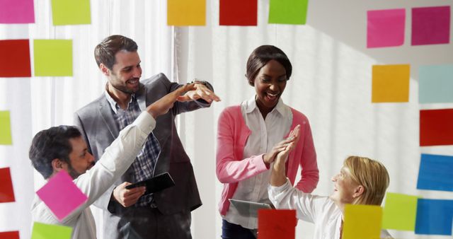 Diverse Team Brainstorming with Colorful Sticky Notes and High Fives - Download Free Stock Images Pikwizard.com