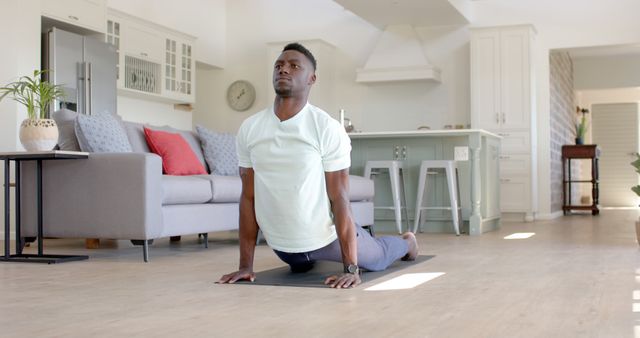 Focused Athlete Practicing Yoga in Modern Living Room - Download Free Stock Images Pikwizard.com