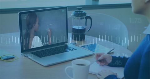 Woman Attending Online Class Taking Notes at Home Office Setup