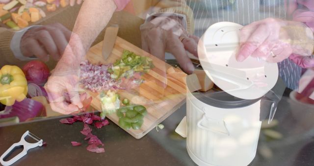 Hands Preparing Vegetables with Knife and Compost Bin in Kitchen - Download Free Stock Images Pikwizard.com