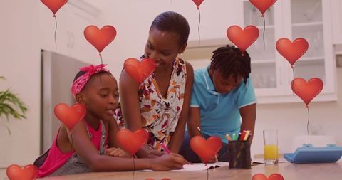 Family Creativity Session with Balloon Hearts Overlay in Modern Kitchen - Download Free Stock Images Pikwizard.com