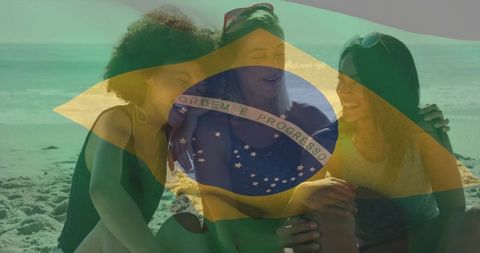 Brazilian beach friends laughing and embracing with translucent flag overlay