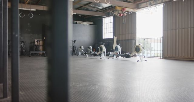 Empty Indoor Gym with Rowing Machines and Training Equipment - Download Free Stock Images Pikwizard.com