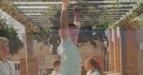 Active Young Boy Playing on Playground Monkey Bars