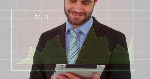 Businessman holding tablet reviewing holographic financial charts and data analytics visual