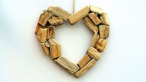 Heart shaped driftwood art decor hanging on wall