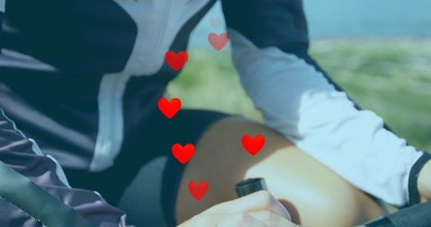 Digital Love Overlay on Sportswoman Cycling Outdoors