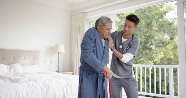 Nurse Helping Elderly Man With Mobility in Bedroom - Download Free Stock Images Pikwizard.com