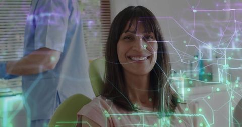 Smiling Patient in Dental Chair with Digital Overlay in Clinic