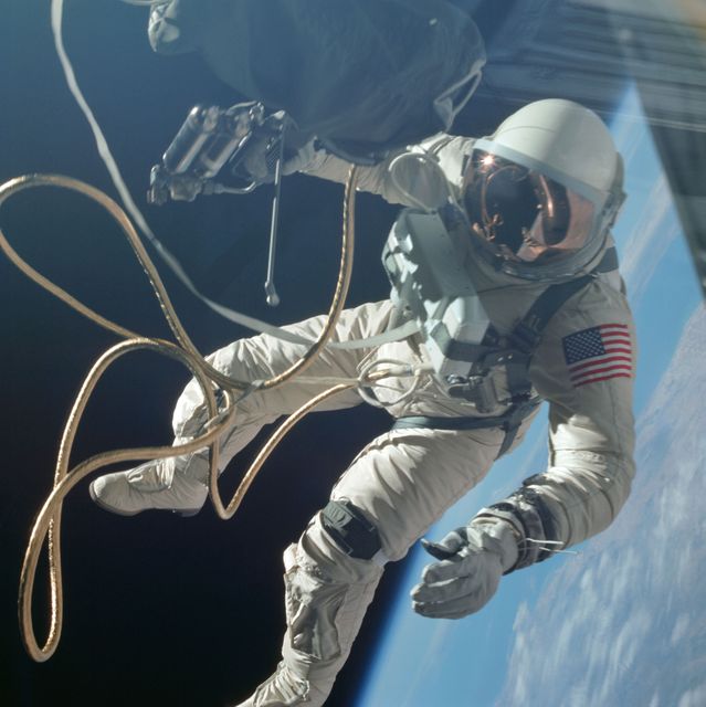 Astronaut Edward H. White II is seen performing an extravehicular activity (EVA), or spacewalk, during the Gemini IV mission. He is floating in the zero gravity of space while tethered to the spacecraft and using a Hand-Held Self-Maneuvering Unit for navigation. Useful for content about space history, human spaceflight, NASA missions, and 1960s technological advancements.