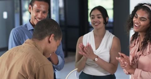Diverse Team Celebrating Successful Achievements in Office