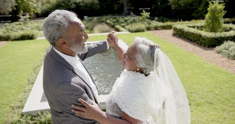 Senior Couple Romantic Wedding Dance in Sunny Garden