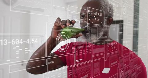 Senior scientist tapping virtual data dashboard with green stylus in modern lab corridor