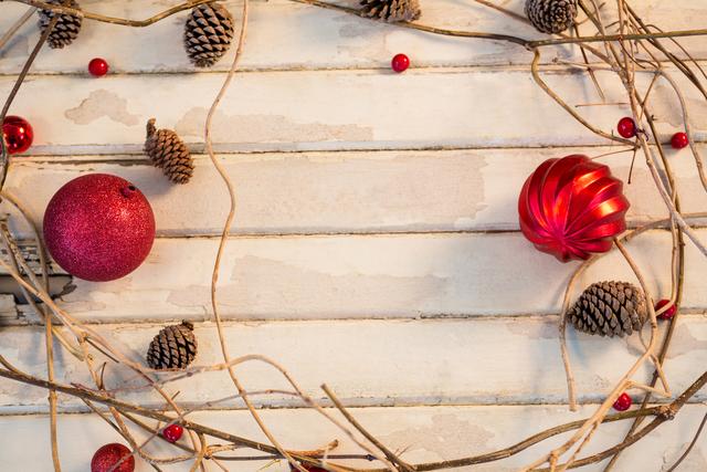 Perfect for holiday greeting cards, festive social media posts, and seasonal advertisements. The rustic setup with natural elements and minimalistic decorations creates a cozy and warm Christmas atmosphere.