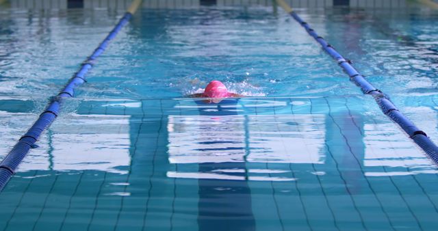 Swimmer Wearing Cap Practicing Freestyle in Pool - Download Free Stock Images Pikwizard.com