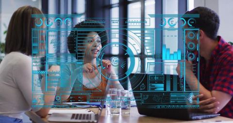 business team analyzing virtual holographic display in modern office - Download Free Stock Images Pikwizard.com