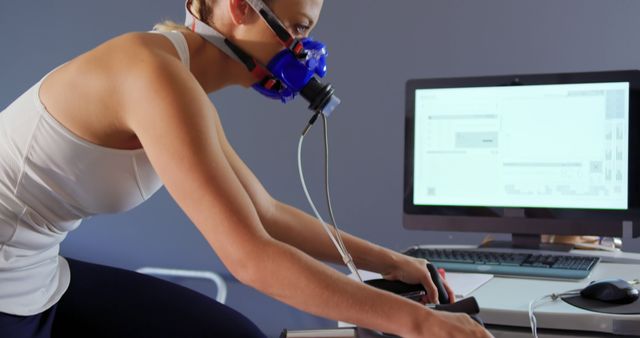 Female Athlete Undergoing Cardio Fitness Testing with Mask and Cycle - Download Free Stock Images Pikwizard.com