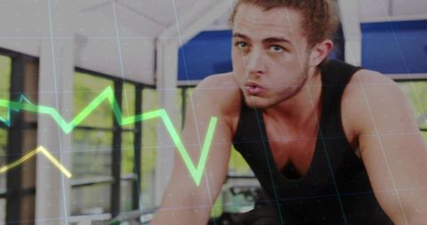 Male Athlete Pedaling Hard on Stationary Bike with Neon Fitness Analytics Overlay