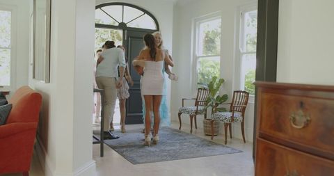 Lively wedding celebration with guests mingling at home