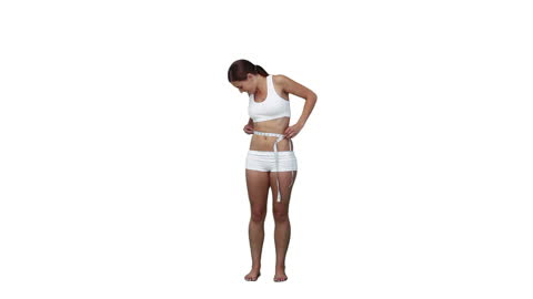 Woman Measuring Waist in Minimalist Setting