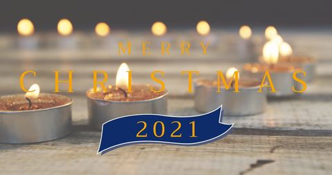 Festive christmas candlelight with text overlay
