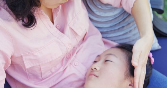 Comforting Mother Holding Sick Child Lying on Lap - Download Free Stock Images Pikwizard.com