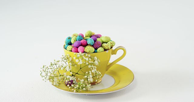 Colorful Easter Candy Eggs in Yellow Teacup with Flower Decoration - Download Free Stock Images Pikwizard.com