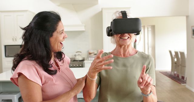 Joyful elderly woman experiencing virtual reality with friends - Download Free Stock Images Pikwizard.com