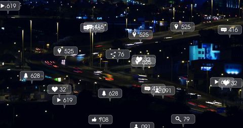 Social Media Interaction Icons Over Urban Night Traffic