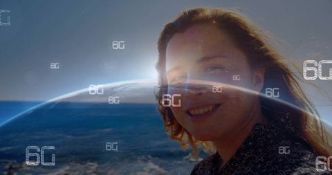Smiling woman by coast with 6g technology icons over ocean horizon
