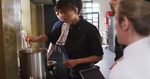 Diverse Culinary Team Collaboration in Professional Kitchen