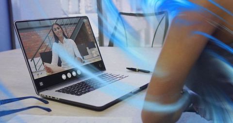 Remote Video Conference Featuring Female Presenter on Laptop Driving Team Collaboration