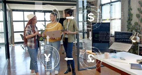 Diverse team collaborating on fintech strategy in modern glass office with currency graphics