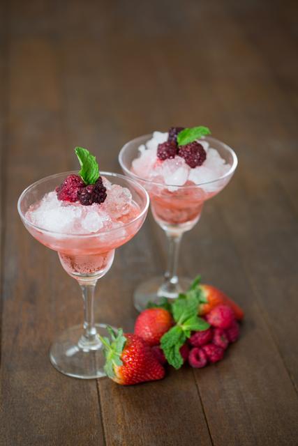 Glasses of strawberry cocktail with mint and crushed ice