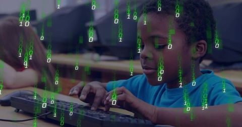 Young student typing keyboard in computer lab with green binary overlay, coding learning