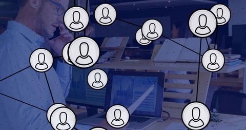Businessman talking on phone in open office with digital network avatars connecting teams