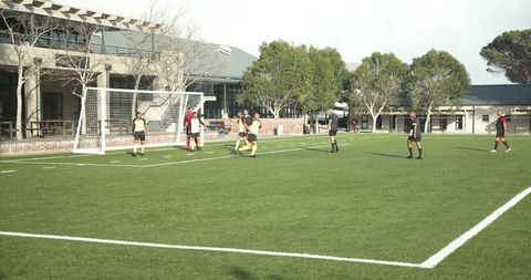 School soccer team preparing for penalty kick